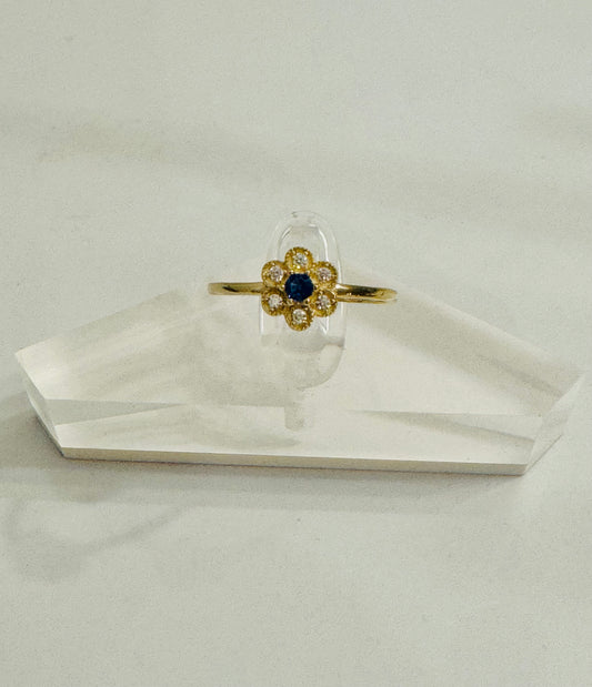 #214 bague en forme de fleurs en zircon centre bleu en or 10k