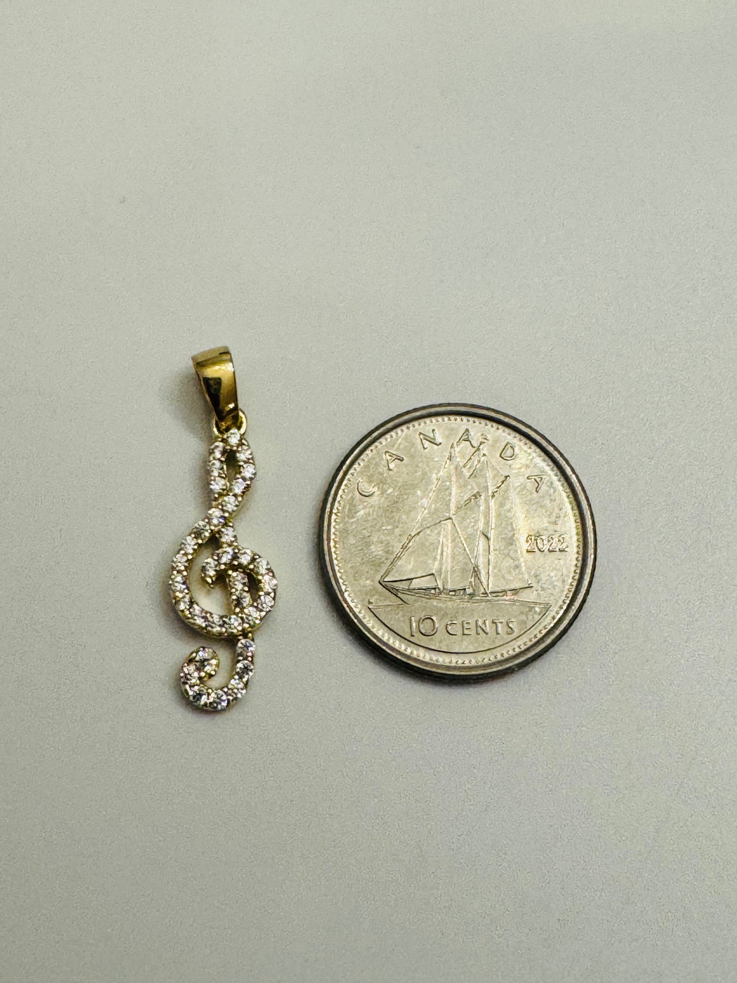 #462 pendentif note de musique clé de sol avec zircon en or 10k