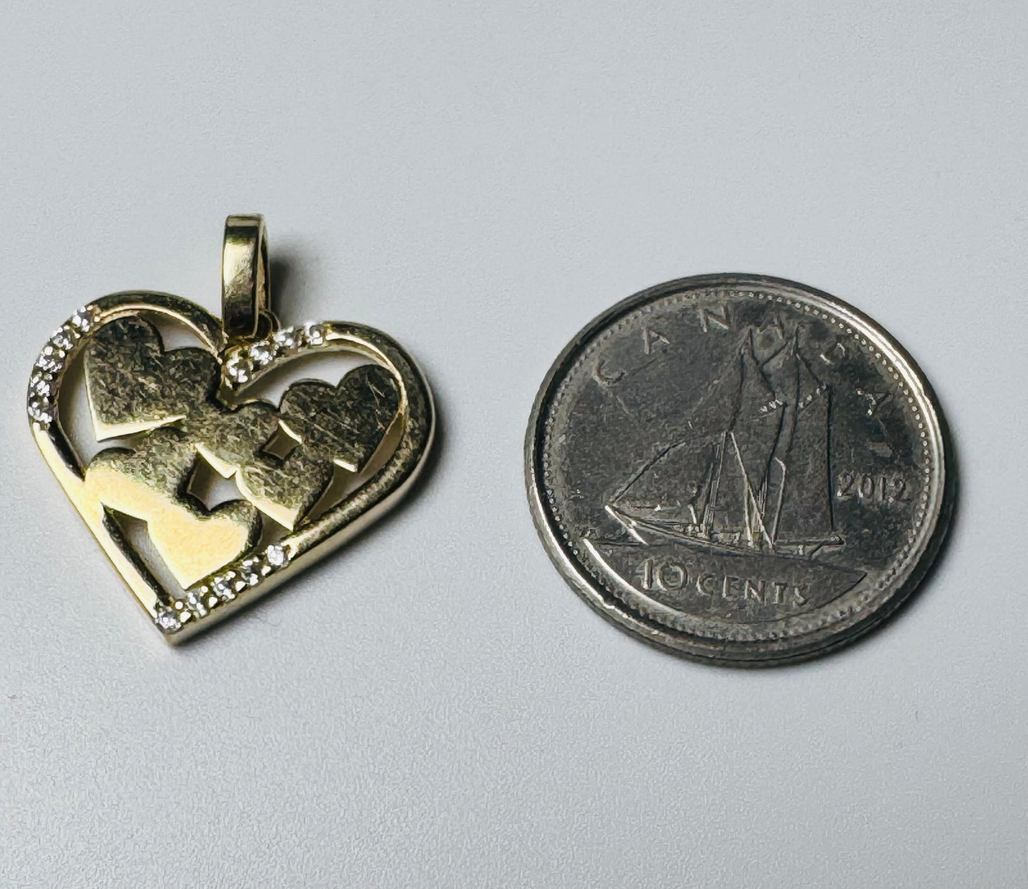 #479 pendentif cœur rempli de cœur avec zircon en or 10 carats