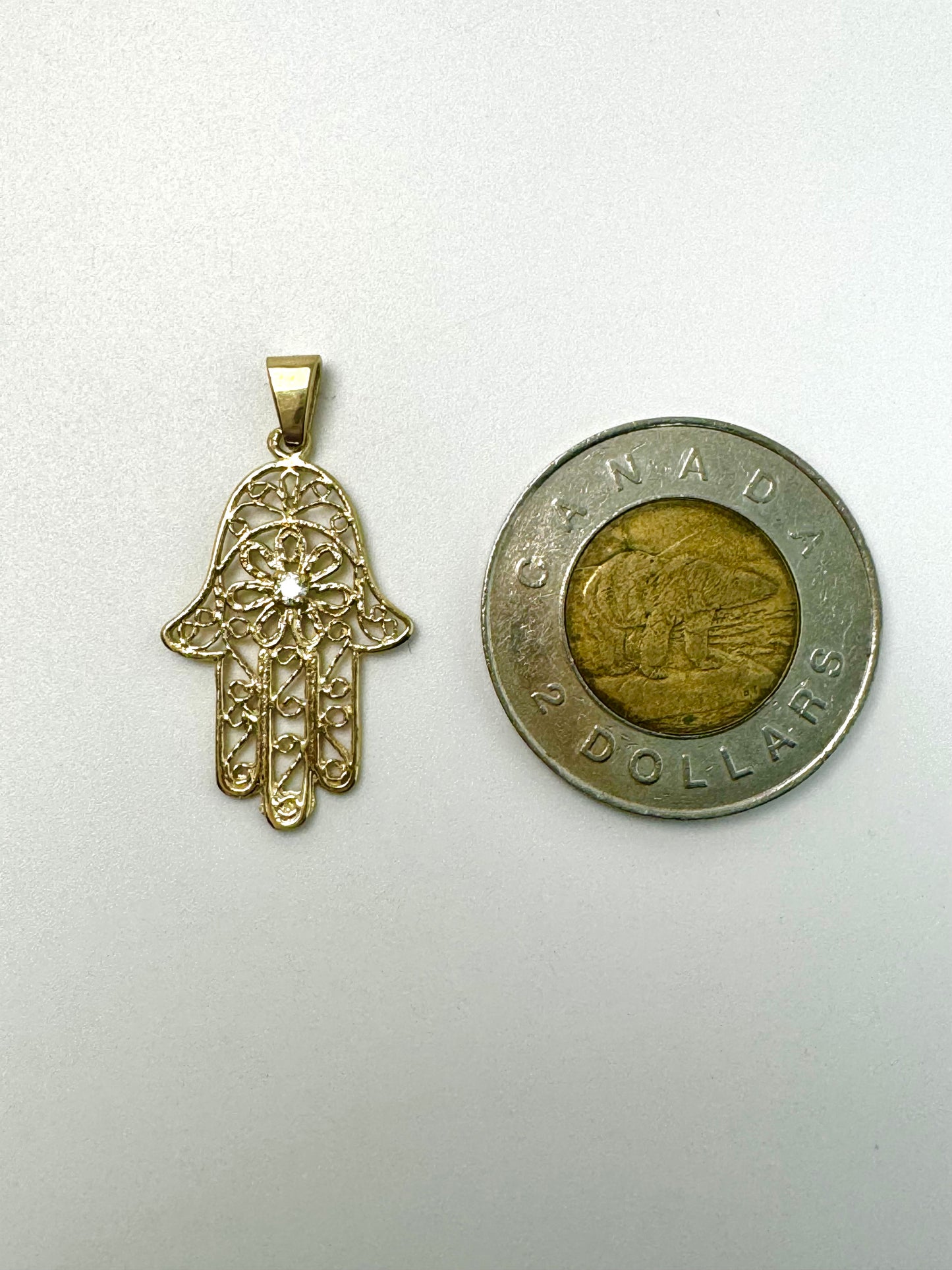 Pendentif en or Main Fatima avec zircon