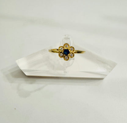 #214 bague en forme de fleurs en zircon centre bleu en or 10k