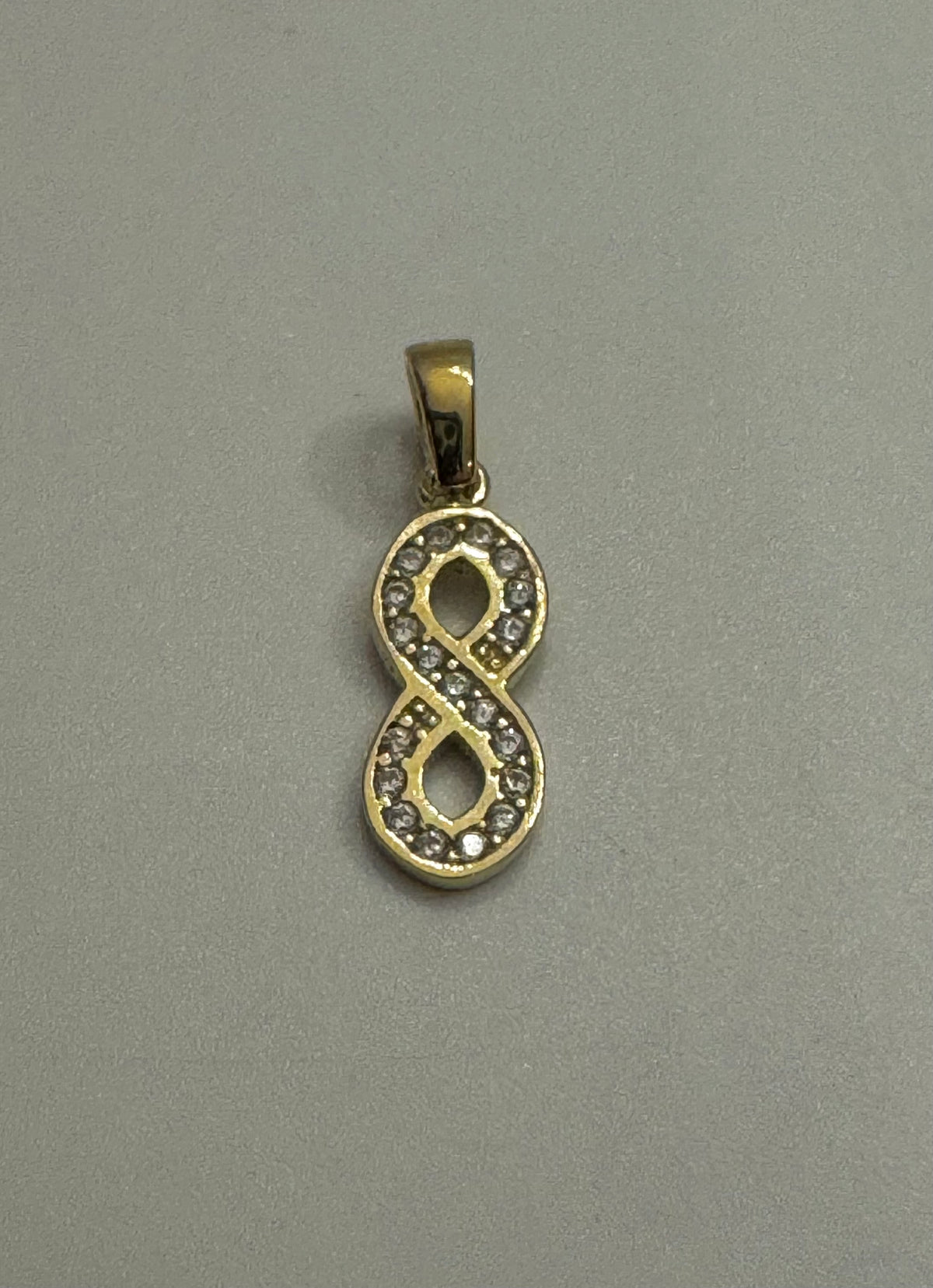 #404 pendentif petite infini avec zircon en or 10k