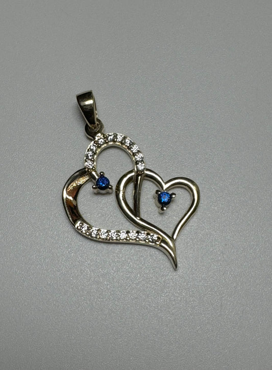 Double heart pendant in gold with blue and white zircon