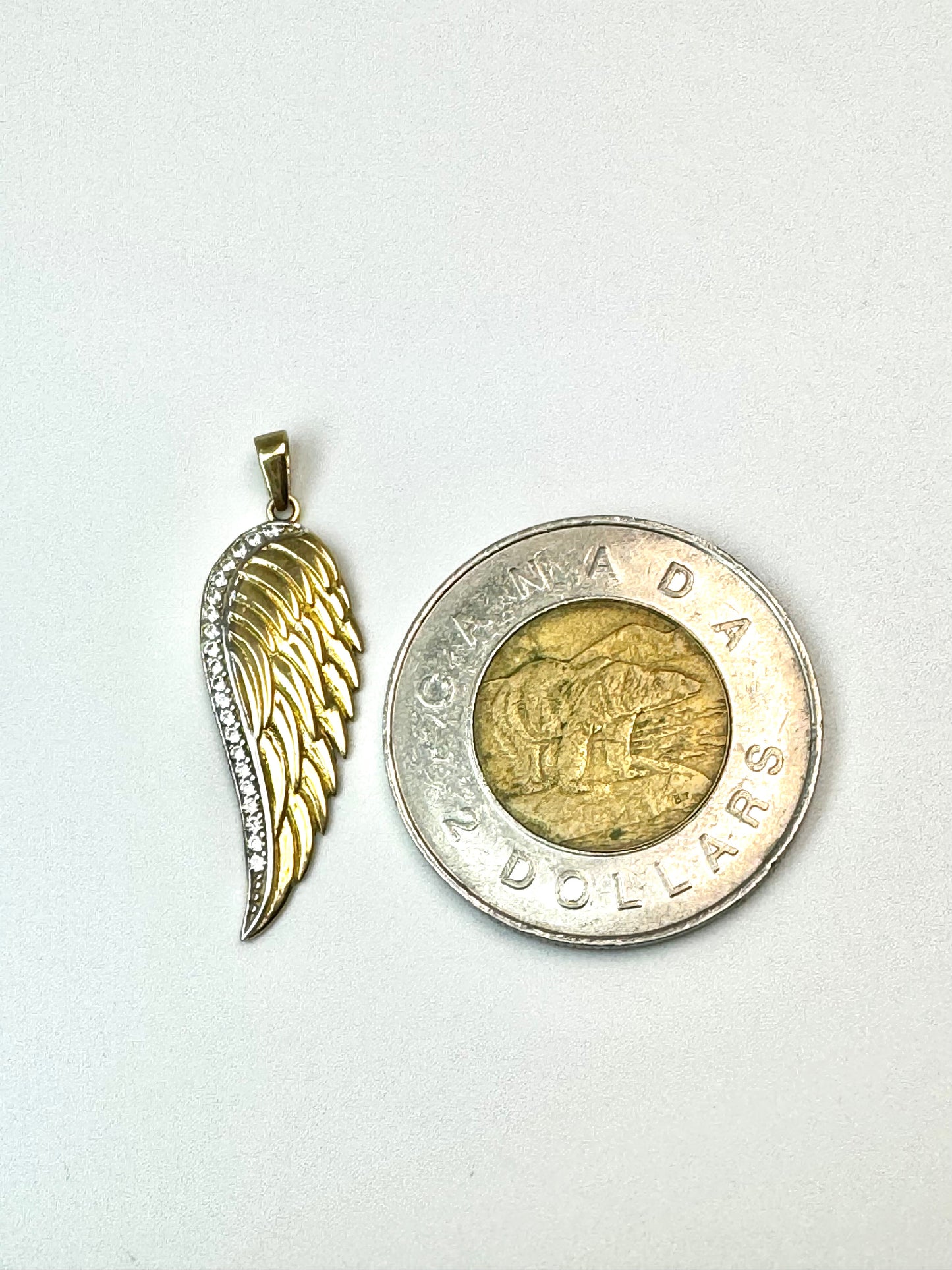 Gold wings pendant with zircon