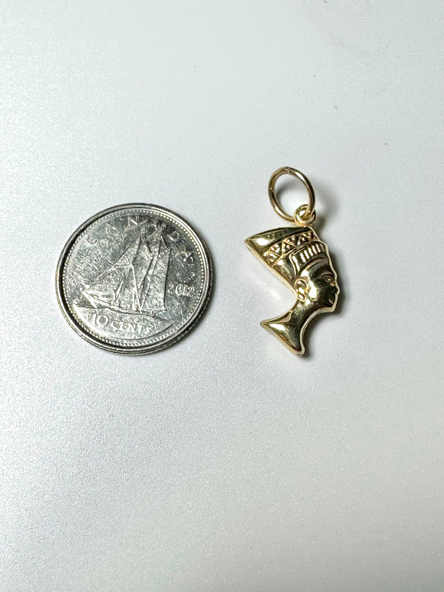 Small gold Nefertiti head pendant