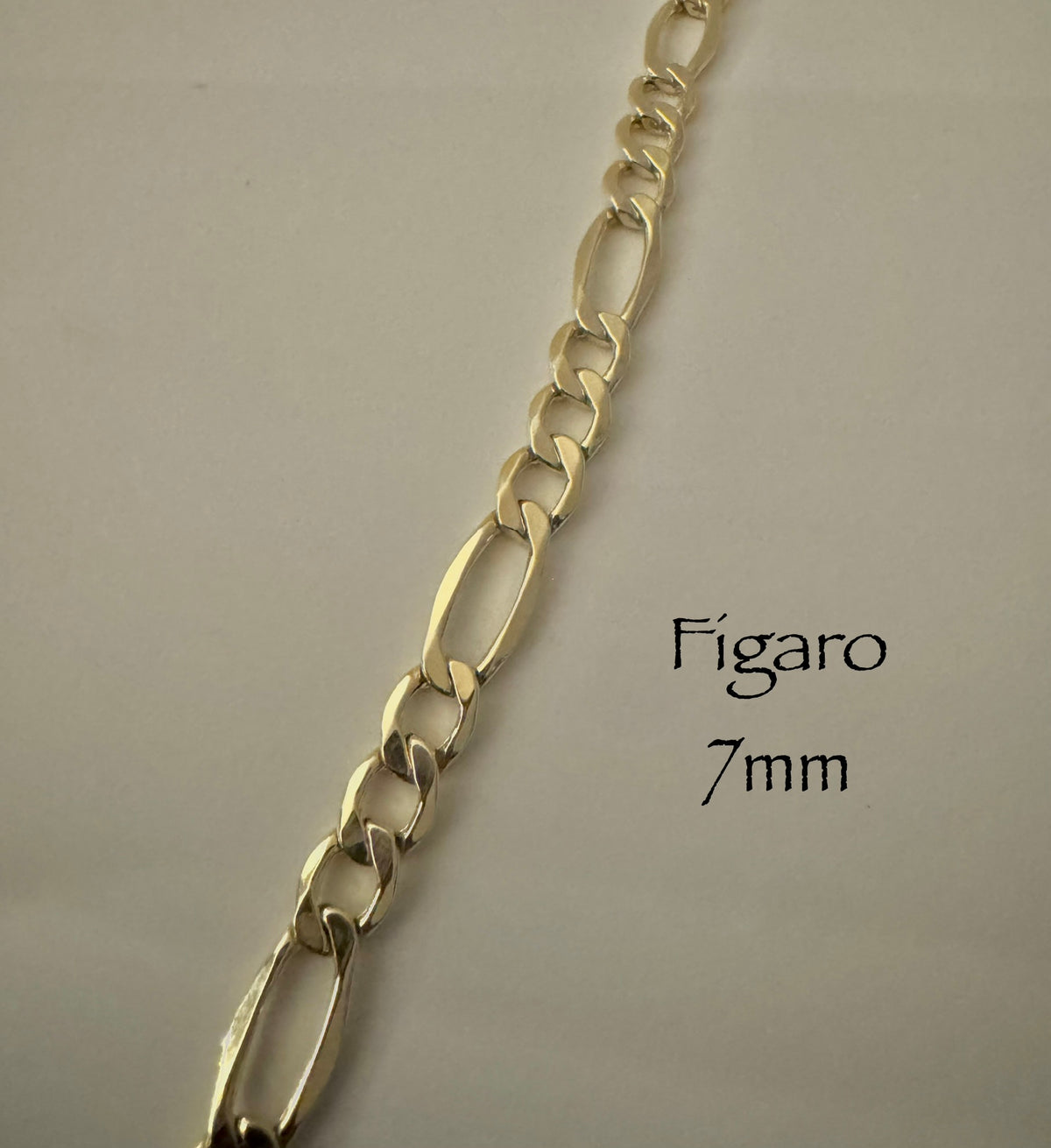 Chaîne figaro 7mm en vrai or 10k