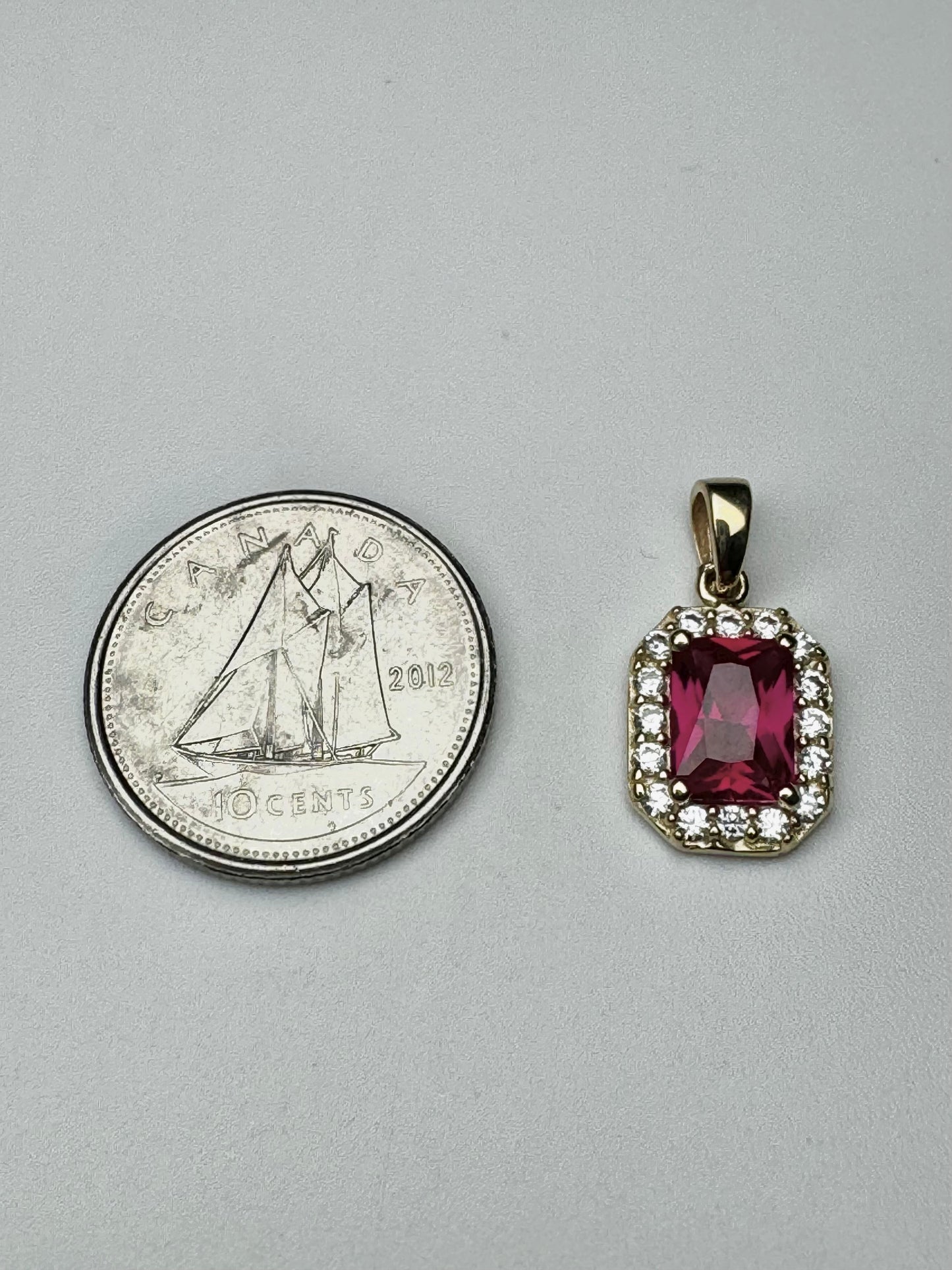 Gold rectangle pendant with red and white zircon