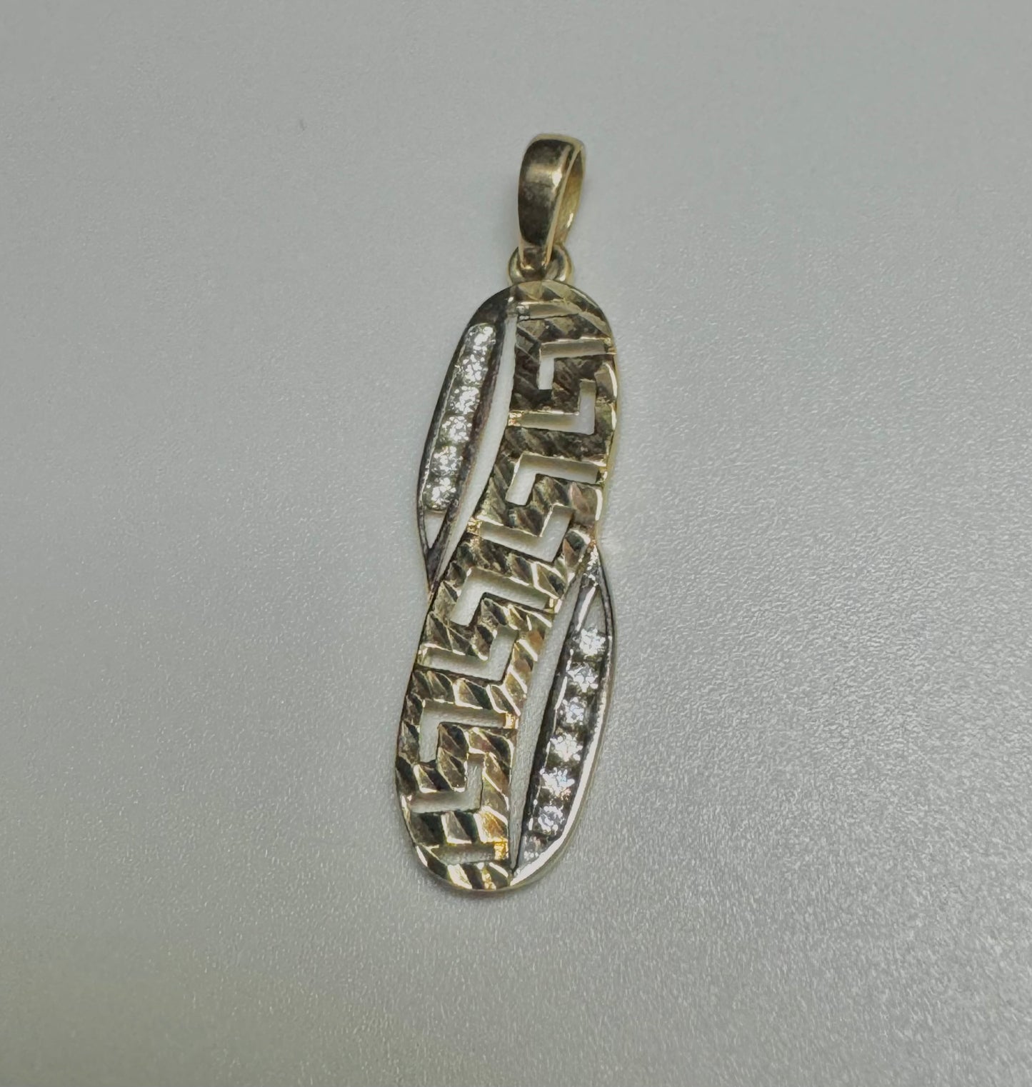 two-tone medusa gold pendant with zircon