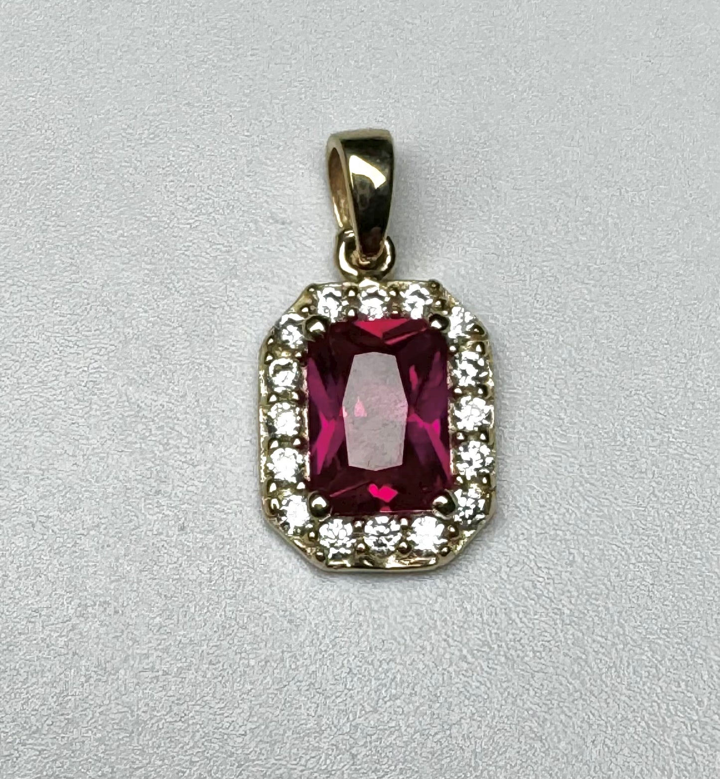 Gold rectangle pendant with red and white zircon