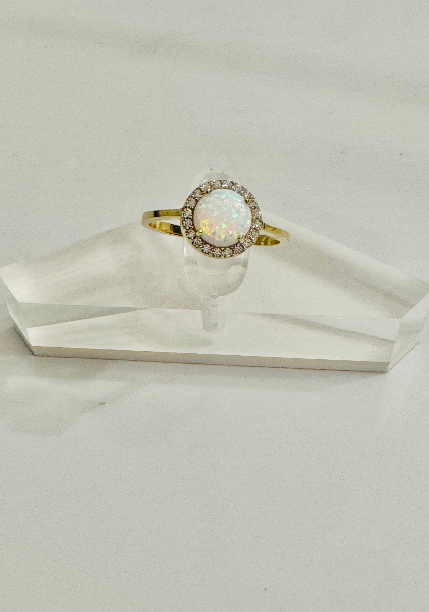 #215 Round ring with brilliant white stone and zircon in 10k gold