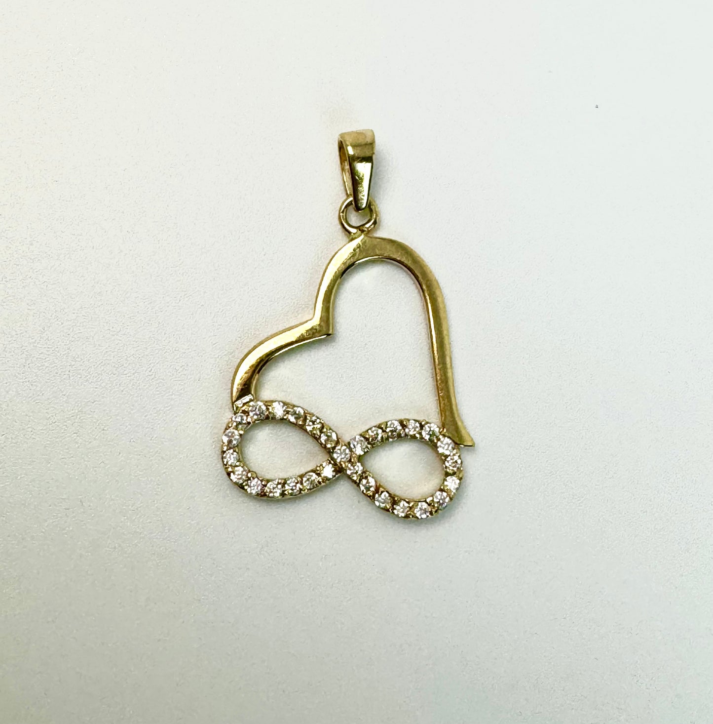 Gold heart pendant with infinity and zircon