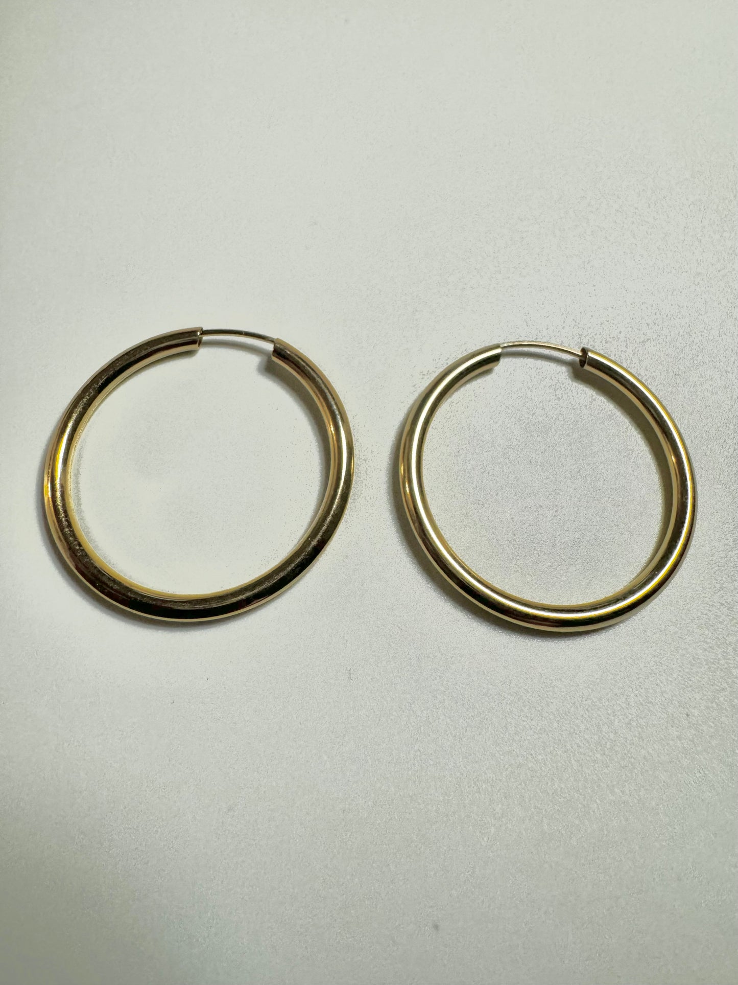 Unis gold hoop earrings