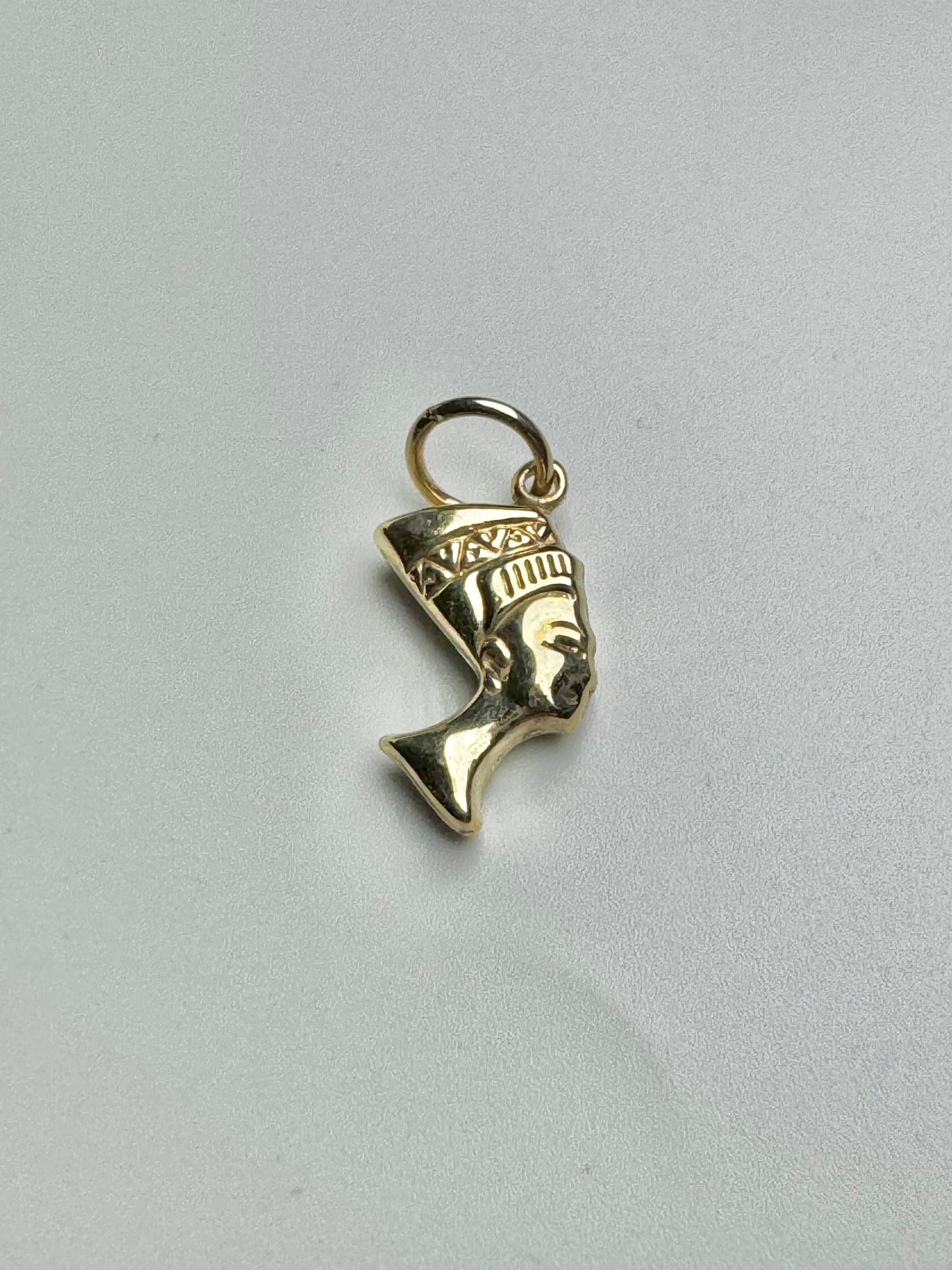 Small gold Nefertiti head pendant