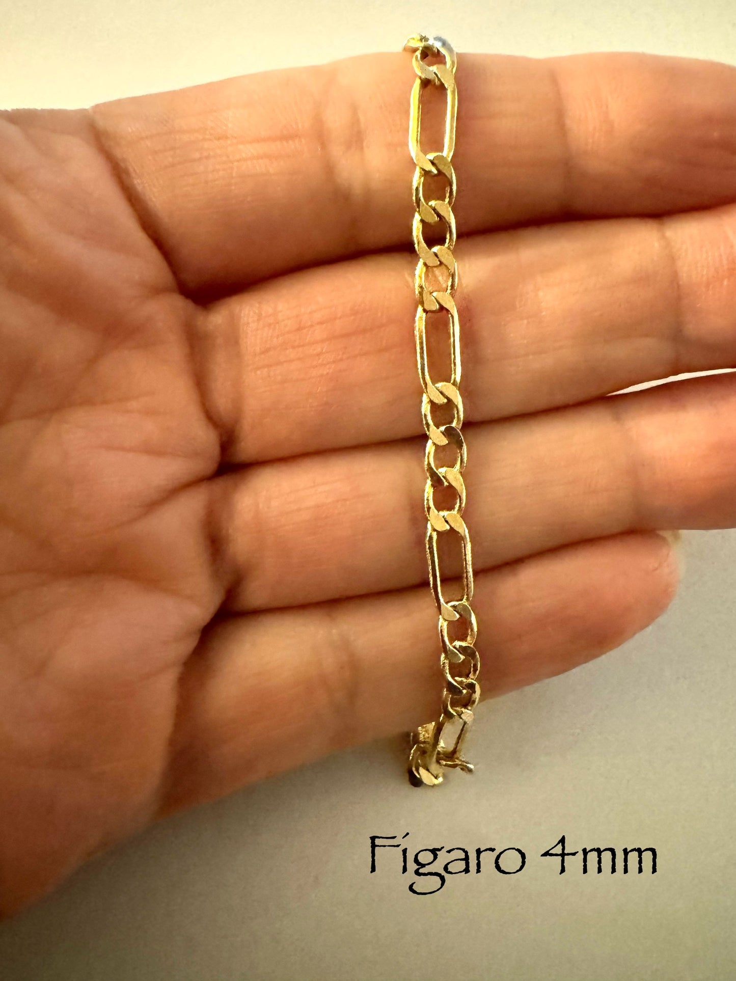 #106 bracelet figaro 4 mm en or 10k