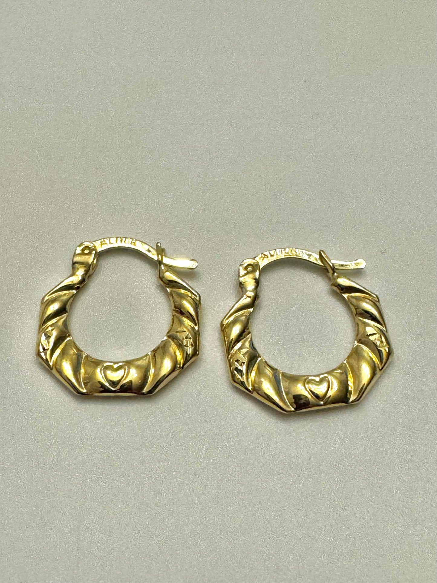 Gold earrings with heart