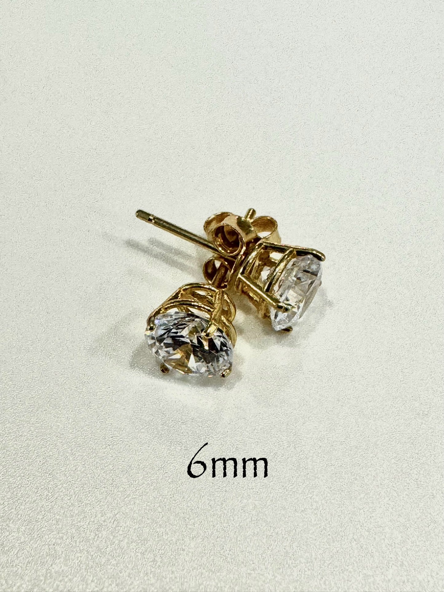 Stud earrings with round white zircon