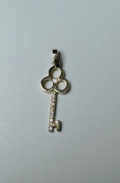 #464 pendentif clé tige en zircon en or 10k