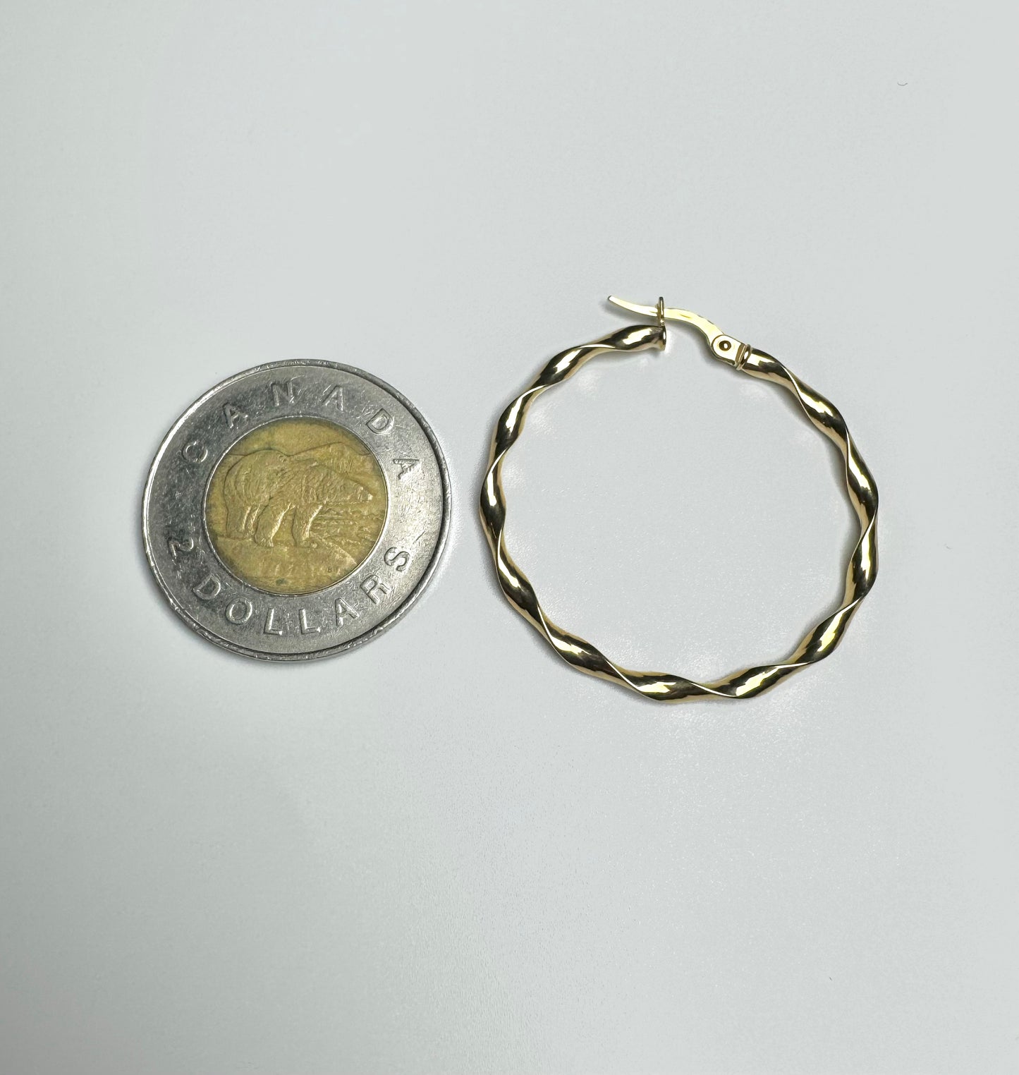 Plain wavy hoop gold earrings