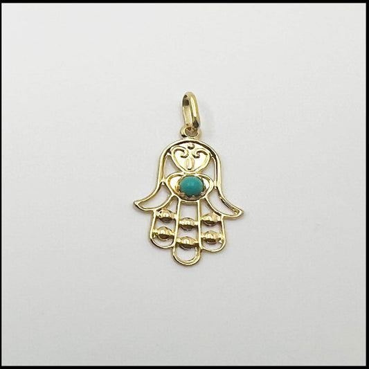 Gold Fatima hand pendant with green zircon