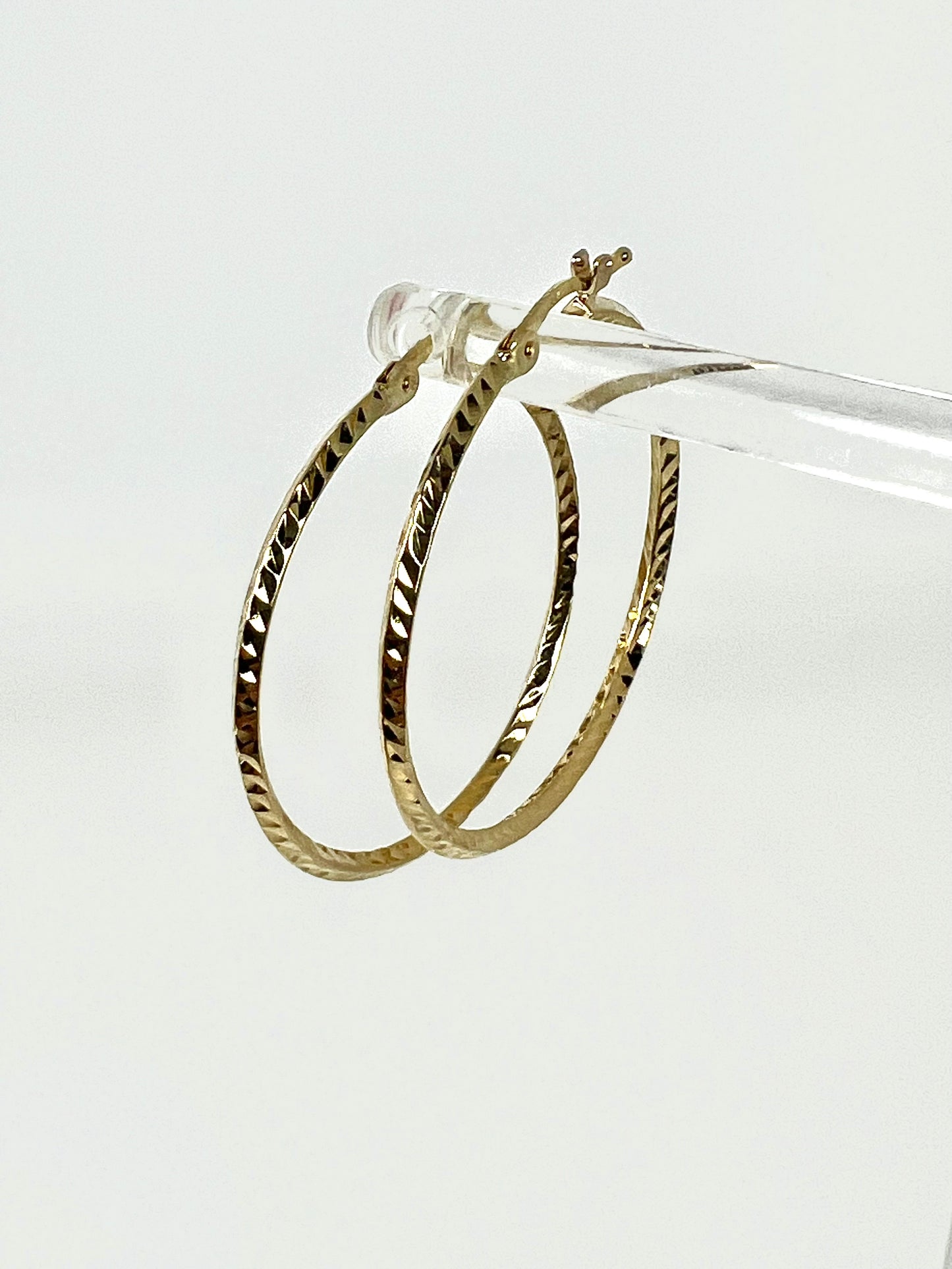 Large thin ring gold earrings with engraving