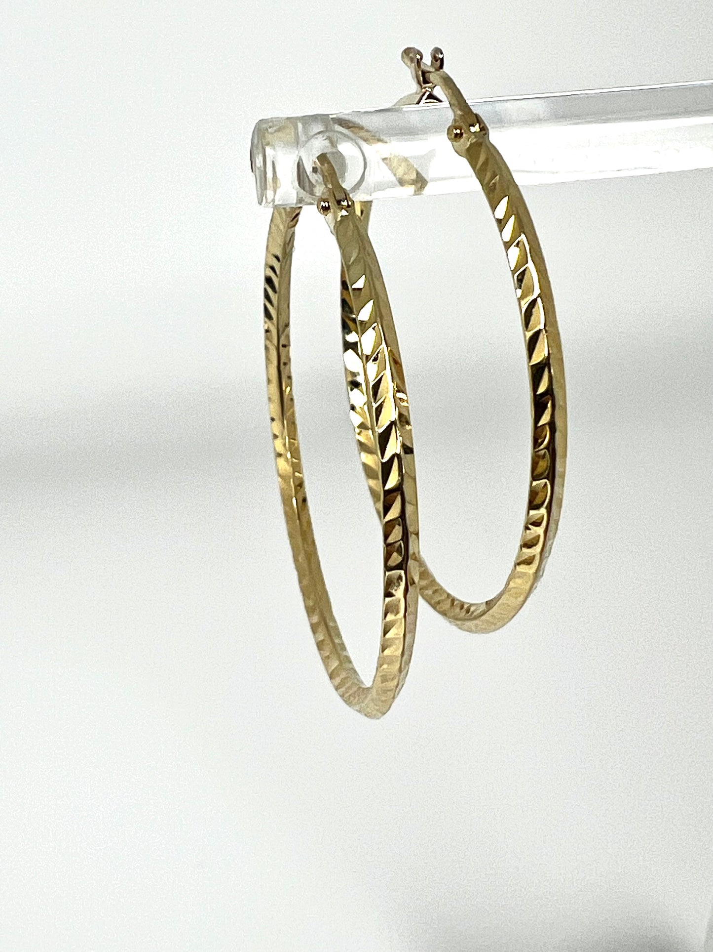 Large thin ring gold earrings with engraving